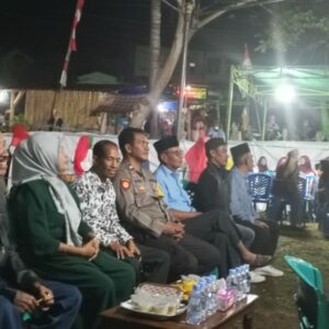 Bhabinkamtibmas Bunga Eja Amankan Perayaan HUT Desa ke-15, Warga Diimbau Kunci Ganda Kendaraan