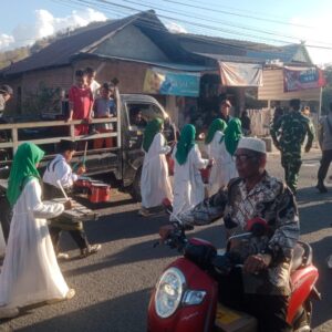 Bhabinkamtibmas Polsek Woha, Laksanakan Pengamanan Pawai Ta’aruf Pembukaan MTQ Tingkat Desa Samili ke-57