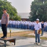 Polisi Peduli Pendidikan, Kapolsek Belo Jadi Irup Bendera di SMA Negeri I Belo